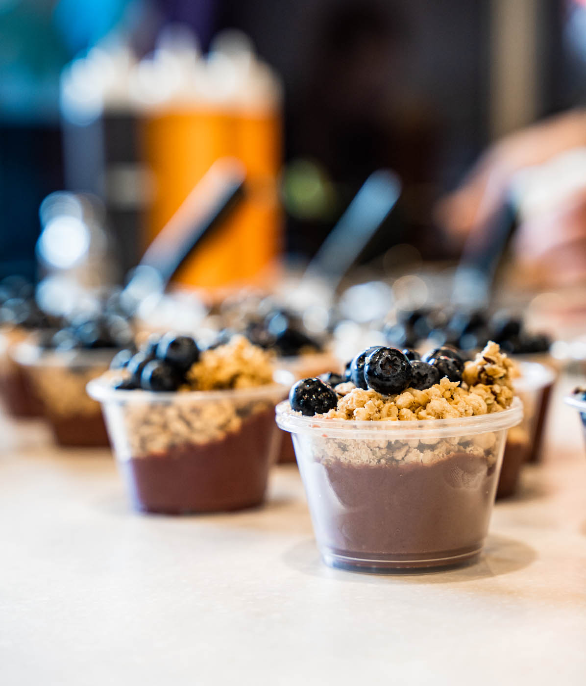 An image of delicious healthy smoothie bowls lined up in a row - bowls sold at Rush Bowls locations.