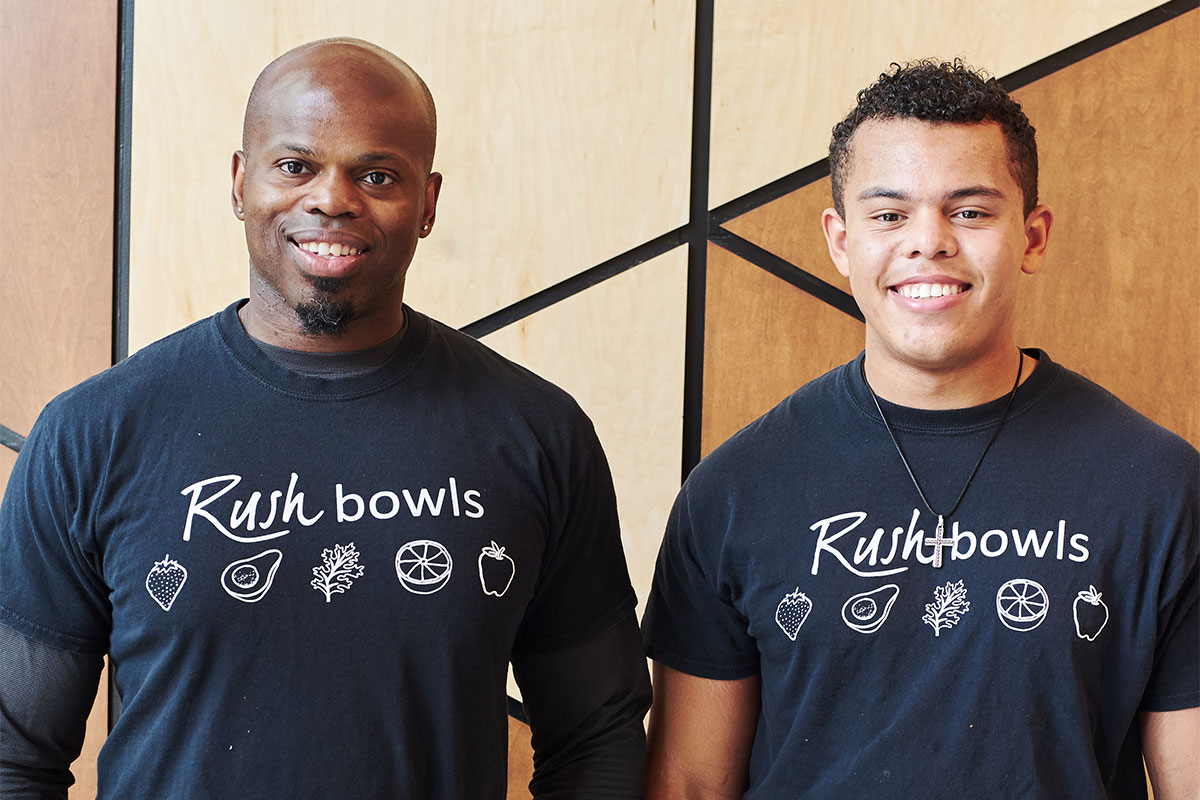 Two Rush Bowls smoothie franchise owners benefiting from our franchisee support.