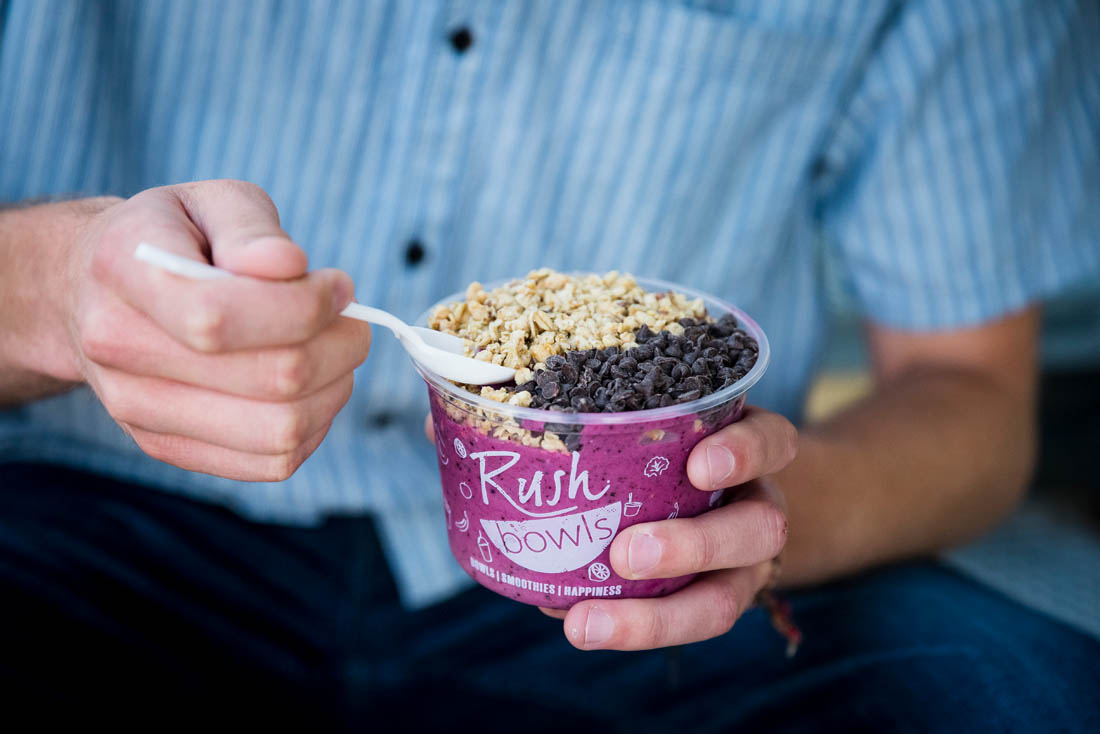 One person enjoying Rush Bowls - contact us to learn more about opening your own smoothie franchise!