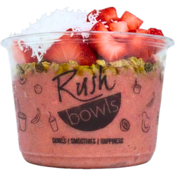 A pink Rush Bowls smoothie bowl with coconut, honey, and granola toppings. 