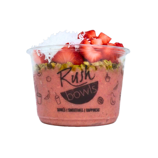 A pink Rush Bowls smoothie bowl with coconut, honey, and granola toppings. 
