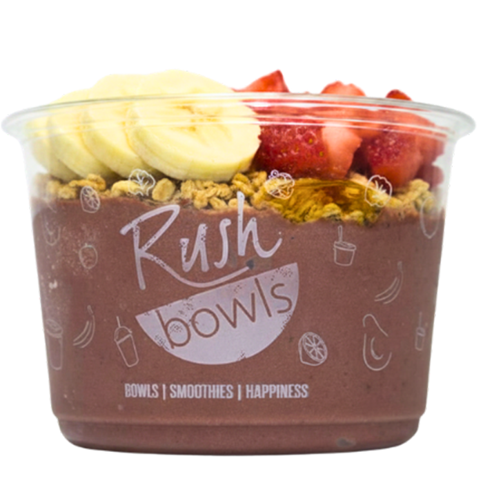 A purple Rush Bowls smoothie bowl with strawberries and granola toppings. 