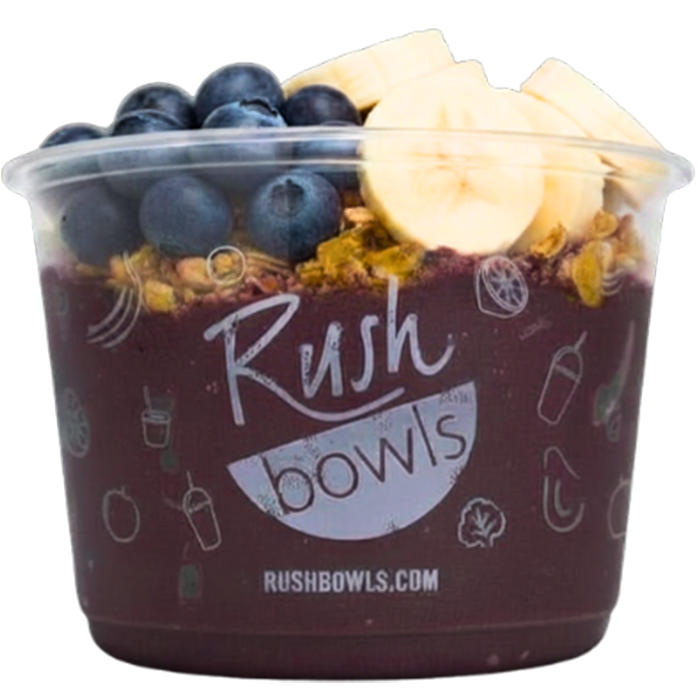 Dark purple smoothie bowl with yummy berry toppings. 