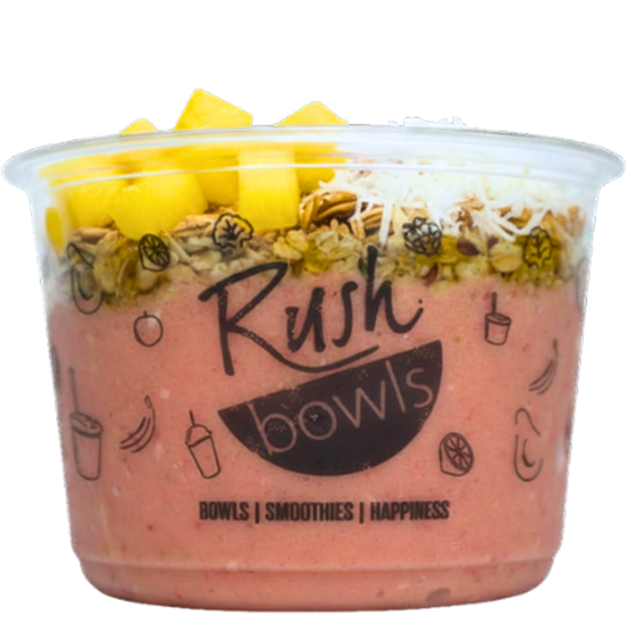 A pink Rush Bowls smoothie bowl with coconut, honey, and granola toppings. 