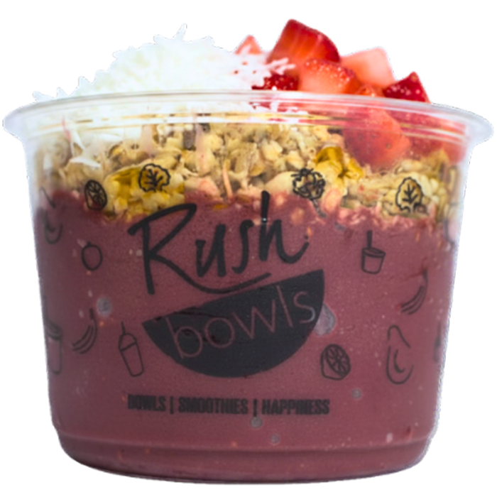 Rush Bowls smoothie pink acai bowl with strawberry and honey toppers.