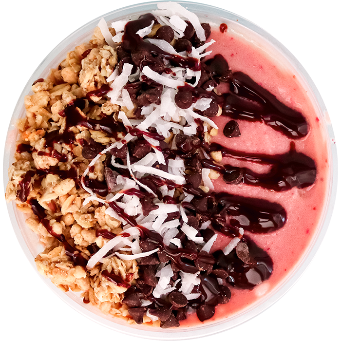 Our yummy granola, chocolate syrup, and strawberries on a smoothie bowl.