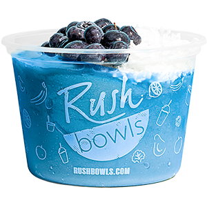 Rush Bowls blue smoothie bowl with blueberries and coconut toppings. 