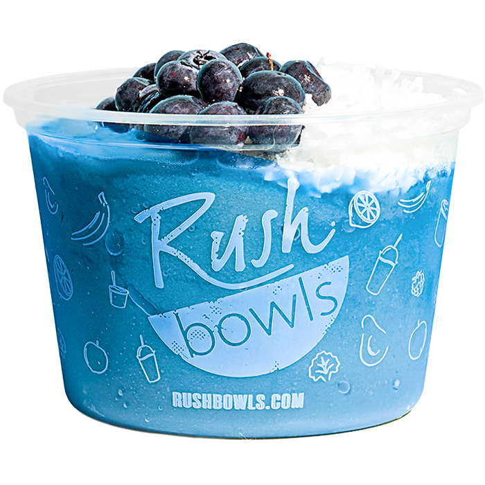 Rush Bowls blue smoothie bowl with blueberries and coconut toppings. 