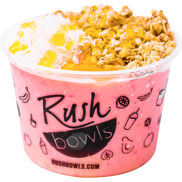 A pink Rush Bowls smoothie bowl with coconut, honey, and granola toppings. 
