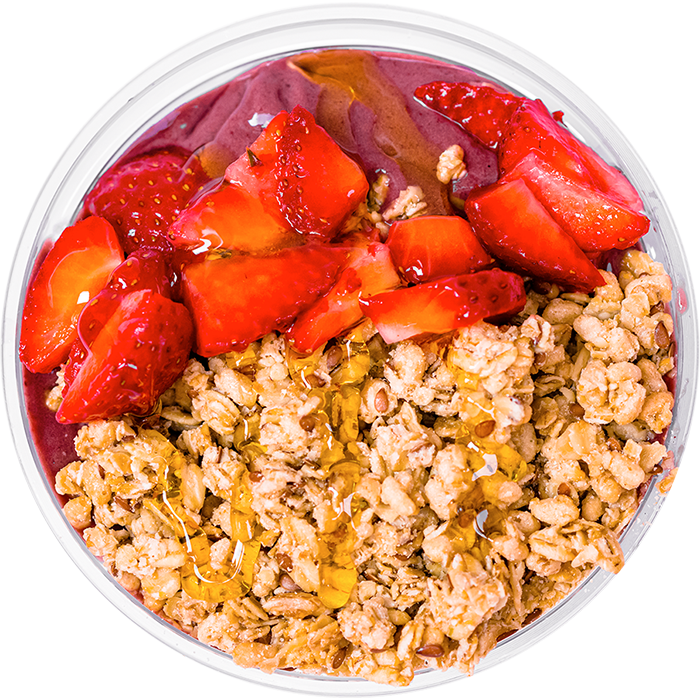 Rush Bowls organic granola, honey, and strawberry toppers.