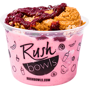 Our protein packed pb&j flavored smoothie bowl topped with honey. 