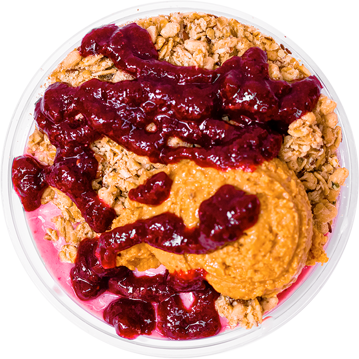 Our pink smoothie bowl topped with granola, honey, jelly, and peanut butter. 